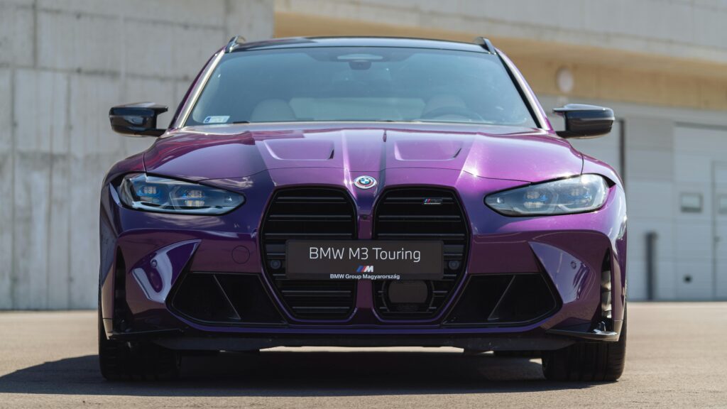 Eye-catching purple BMW M3 Touring parked outdoors in Balatonfőkajár, Hungary.